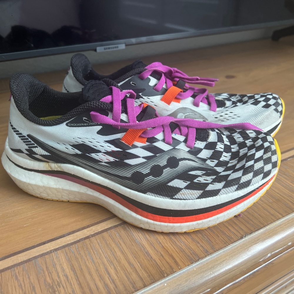 Saucony Checkered Athletic Shoes with Pink and Orange Accents